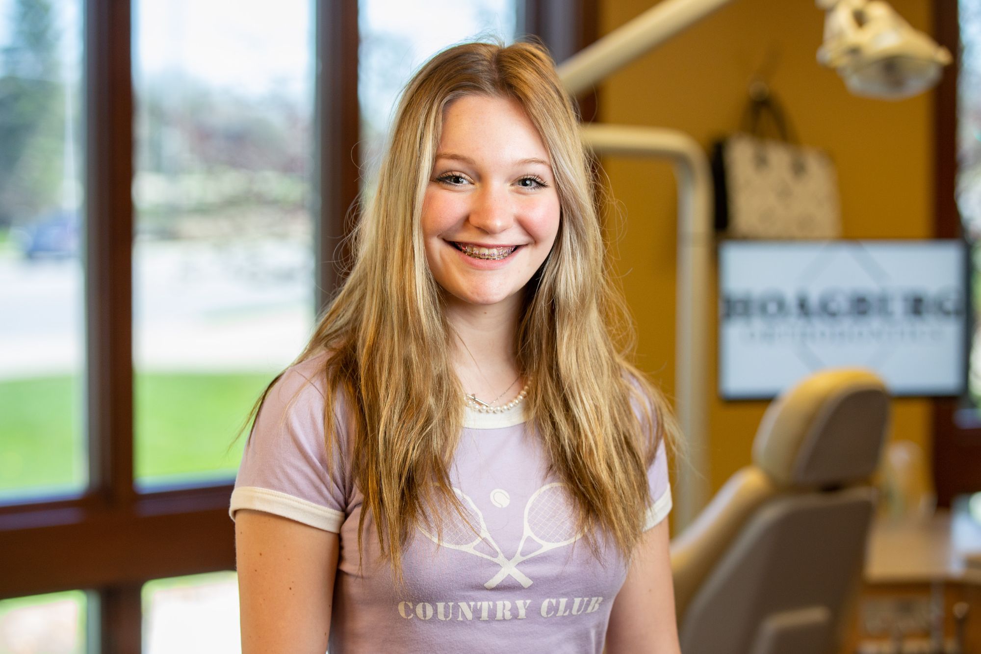 Fort Wayne patient with clear aligners showing a confident smile