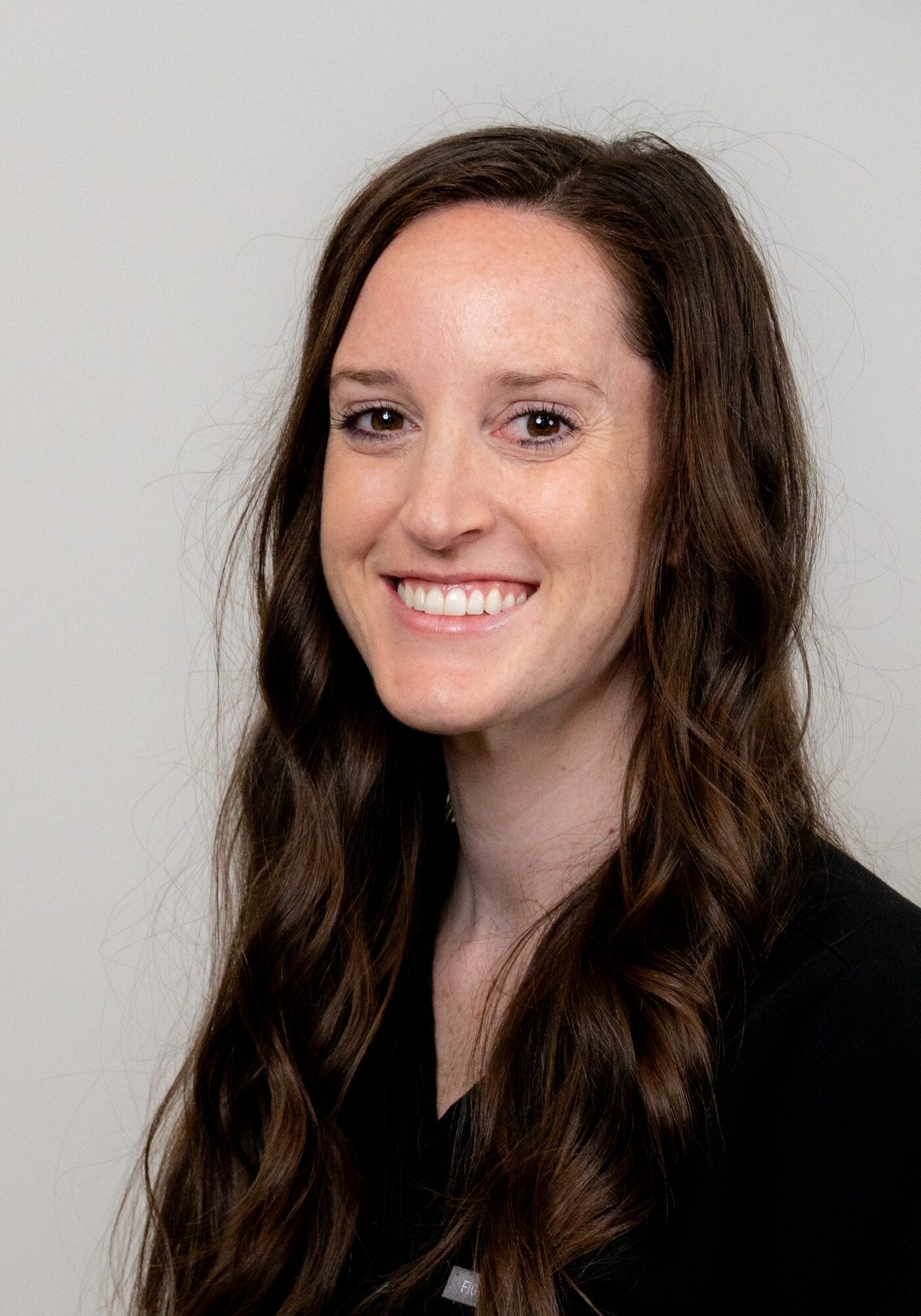 Lauren, smiling orthodontic tech at Hoagburg Orthodontics, showcasing expertise and friendly demeanor.